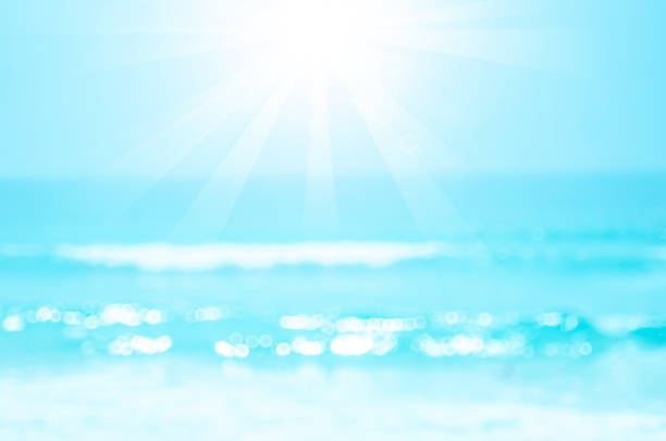istock Copy space blur tropical beach with bokeh sun light wave on blue sky and white cloud abstract background. 1186119664