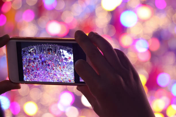 istock Cellphone take a photo defocused night light beautiful background 1186119712