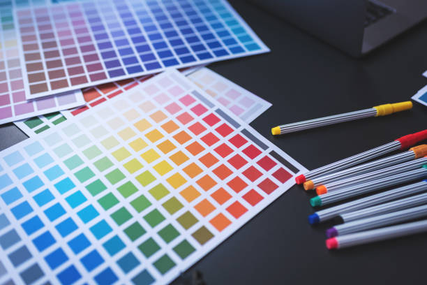 istock Color Swatches with many objects put on black working desk in co-working space room. 1186119713