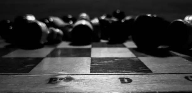 Photo of Chess in the close-up. Chess pieces on a chessboard.