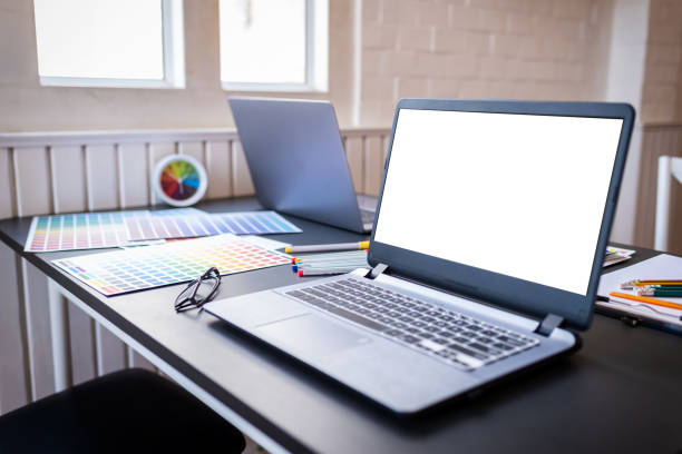 istock Laptop and color swatches put on working table in co-working space room. 1186120741