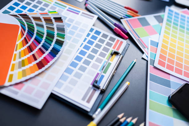 istock Color Swatches with many objects put on black working desk in co-working space room. 1186120946