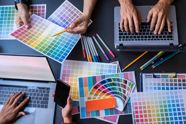 istock Top view graphic design colleagues teamwork choosing color swatches, view from above. 1186121004