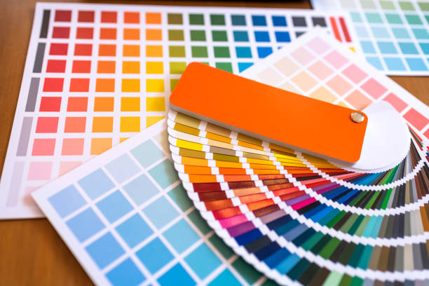 istock Color Swatches with many objects put on black working desk in co-working space room. 1186121016