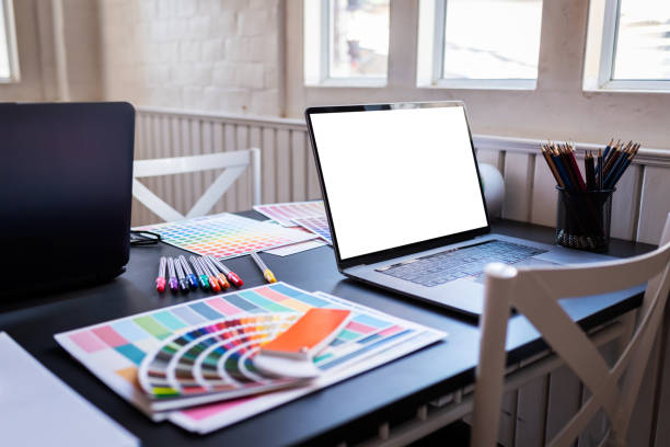istock Laptop and color swatches put on working table in co-working space room. 1186121029