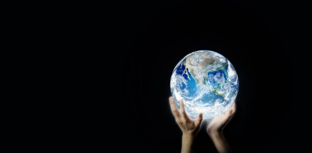 istock Hand holding blue planet earth globe in dark light. 1186121269