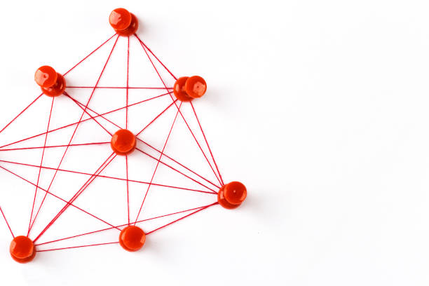 istock Network connection made from push pins and thread on blue background, close-up. 1186121372