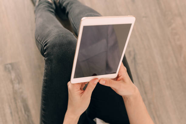 istock A picture of a young woman working on a tablet computer 1186121488