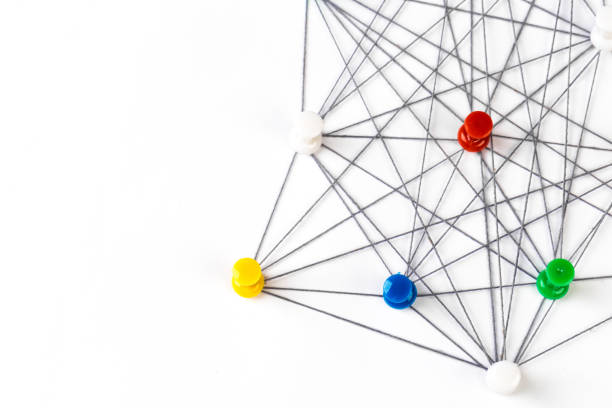 istock Network connection made from push pins and thread on blue background, close-up. 1186122102