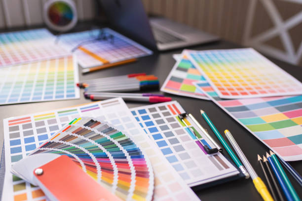 istock Color Swatches with many objects put on black working desk in co-working space room. 1186122139