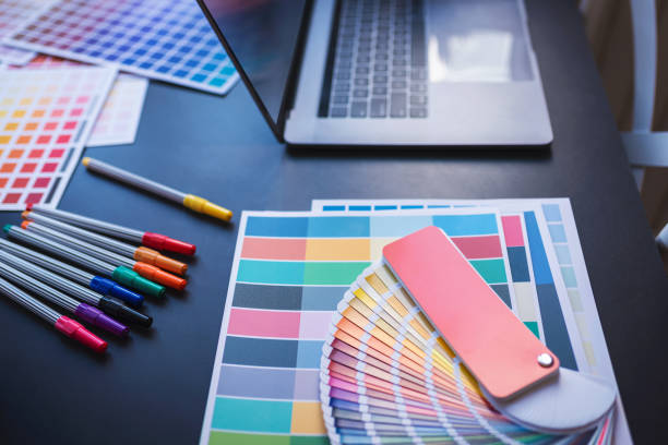 istock Color Swatches with many objects put on black working desk in co-working space room. 1186122258