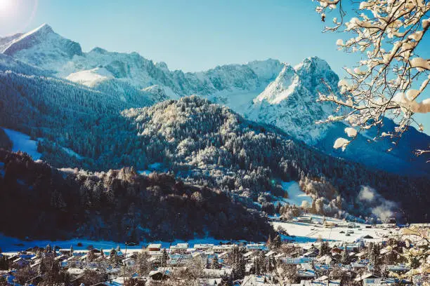 Wonderful panorama of Garmisch-Partenkirchen and the German Alps. Here you can see the Wetterstein Mountains with the Alpspitze on the left and Germany's highest mountain Zugspitze on the right behind the Waxensteine.