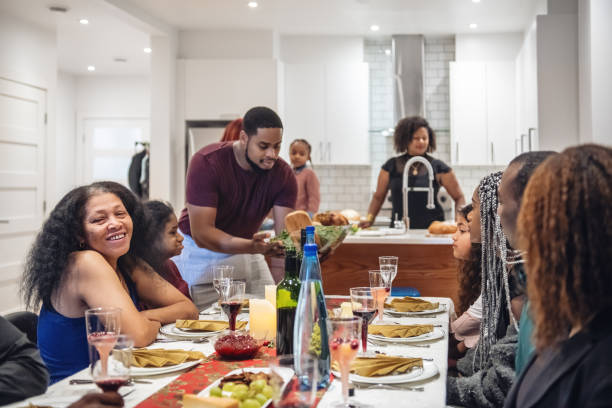 istock Multi-generation ethnic family preparing Thanksgiving dinner 1186126140