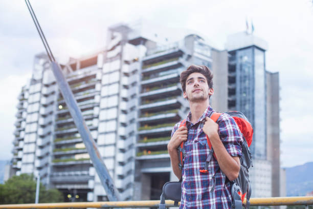 istock young latin man traveling alone 1186126292