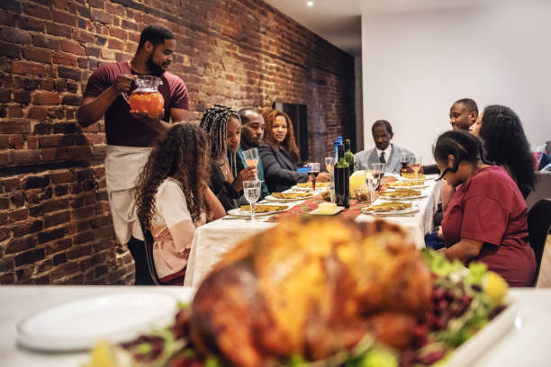 istock Multi-generation ethnic family preparing Thanksgiving dinner 1186126298