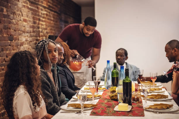 istock Multi-generation ethnic family preparing Thanksgiving dinner 1186126950