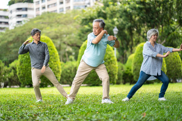 istock Asian people practicing tai chi in  park 1186127185