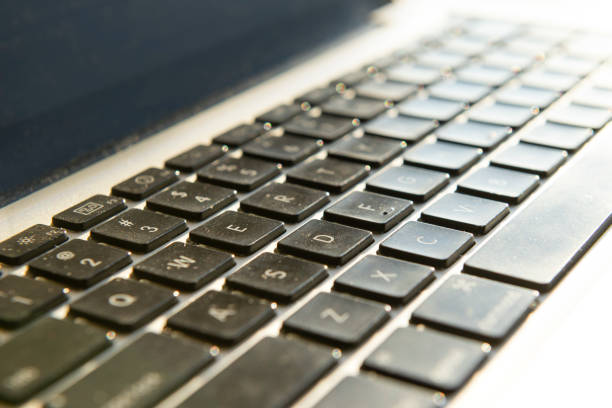 istock black keyboard buttons with letters and dust, laptop, gadget 1186127562