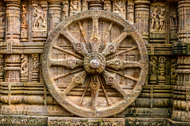 Ancient sandstone carvings on the walls of the ancient sun temple at Konark, India. Ancient sandstone carvings on the walls of the ancient sun temple at Konark, India. chariot wheel at konark sun temple india stock pictures, royalty-free photos & images