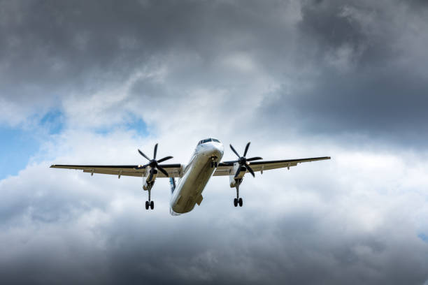 istock Propeller airplane flying in the cloudy skies 1186130409