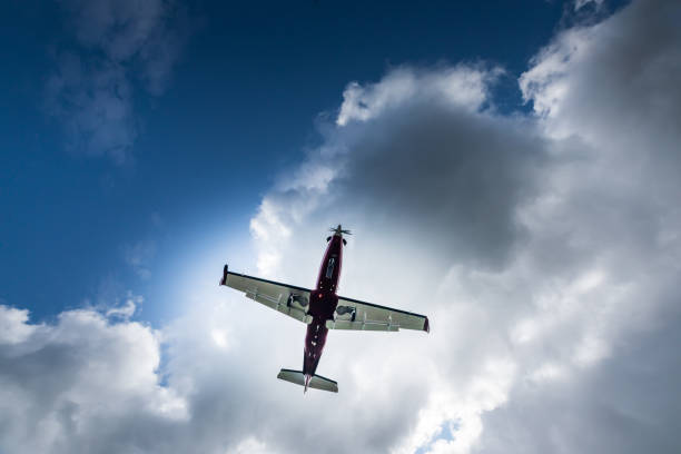 istock Propeller airplane flying in the cloudy skies 1186130459