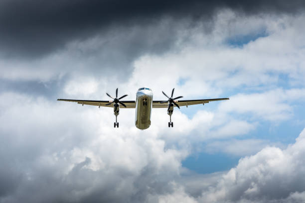 istock Propeller airplane flying in the cloudy skies 1186130503