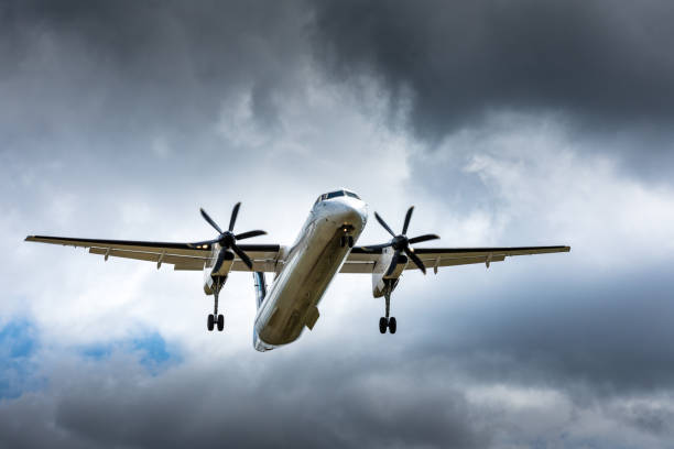 istock Propeller airplane flying in the cloudy skies 1186130509