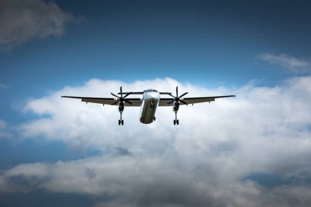 istock Propeller airplane flying in the cloudy skies 1186130554