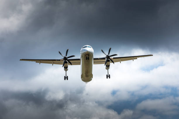istock Propeller airplane flying in the cloudy skies 1186130579