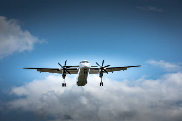 istock Propeller airplane flying in the cloudy skies 1186130596