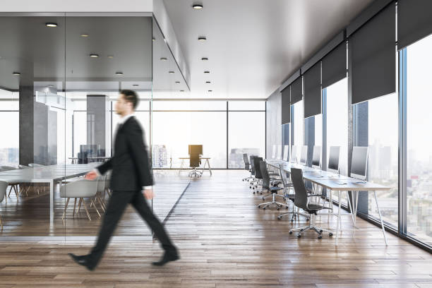 istock Businessman in modern concrete office interior 1186130726
