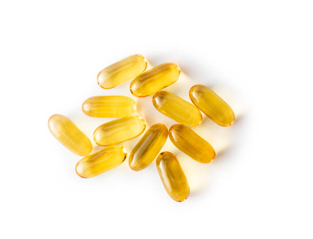 capsules d'huile de poisson - vitamin pill capsule vitamin e fish oil photos et images de collection