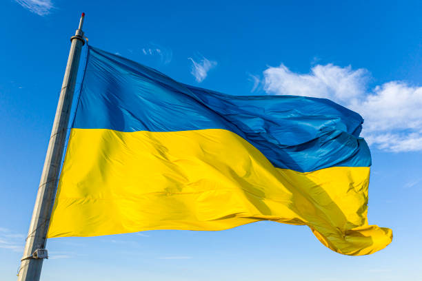 istock Ukrainian flag background of blue sky with white clouds. 1186133563