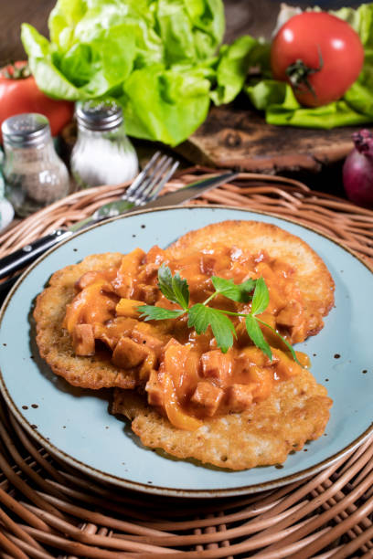 istock Homemade potato pancakes with goulash. 1186133668
