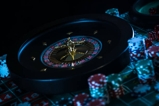 istock Casino background, poker Chips on gaming table, roulette wheel in motion, 1186136501
