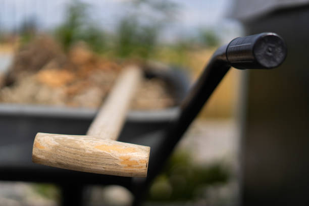 Yellow wheelbarrow is a tool in the construction site or garden isolated on a white background included clipping path.