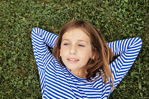 portrait of a young girl on the grass