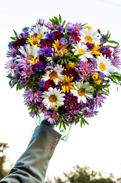 istock Bouquet from a camomile and other flowers 1186140174