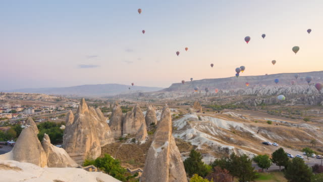 Timelapse Hot Air Balloons flying over rock landscape Goreme National Park Cappadocia  at Turkey