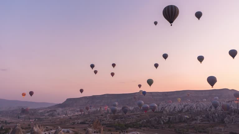 Timelapse Beautiful Hot Air Balloons flying over rock landscape Goreme National Park Cappadocia  at Turkey