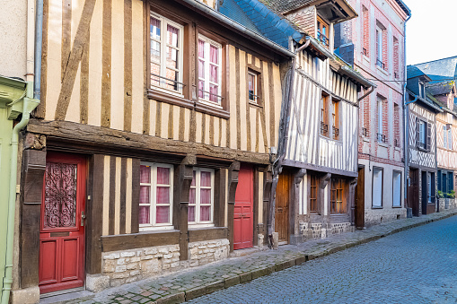Honfleur in Normandy, typical street with half-timbered houses