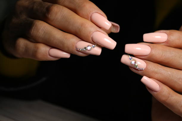 istock manicure with long nails on a trendy texture background 1186145718
