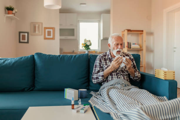 istock Elderly Man Blowing His Nose 1186148303