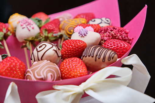 A bouquet of chocolate covered strawberries with different toppings like chocolate coconut cocoa almonds nuts. Chocolate Strawberry Fondue. Romantic gif