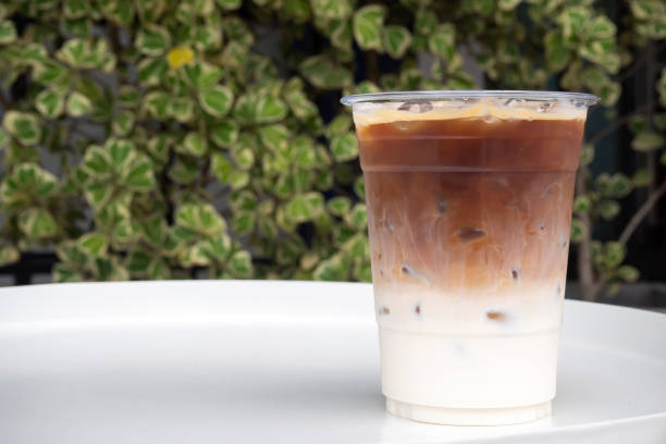istock Glass of ice latte in plastic cup. 1186150406
