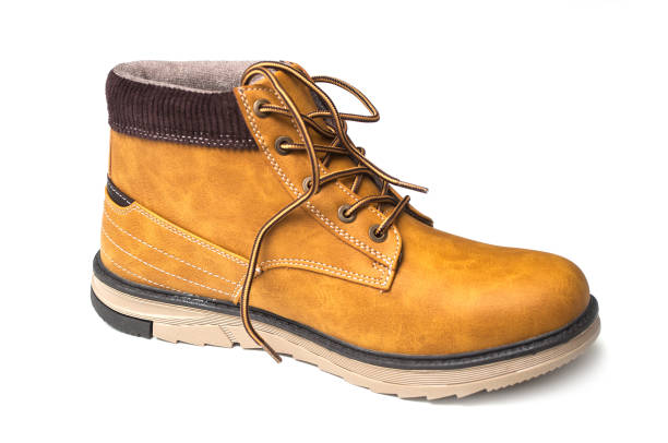 istock orange leather boots for men on white background 1186153269