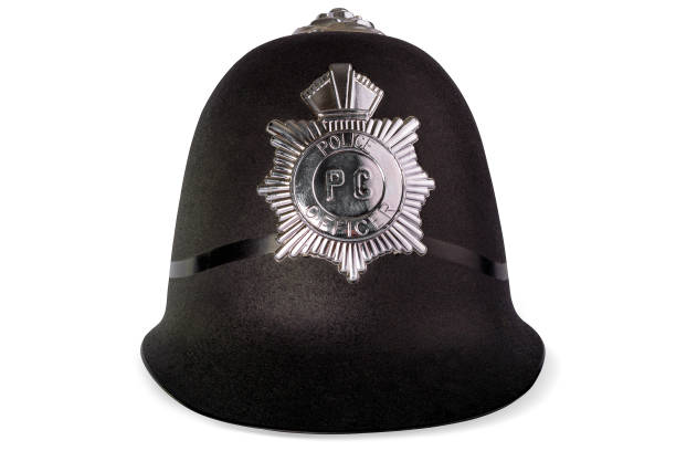 istock A black police helmet on white background. 1186156184