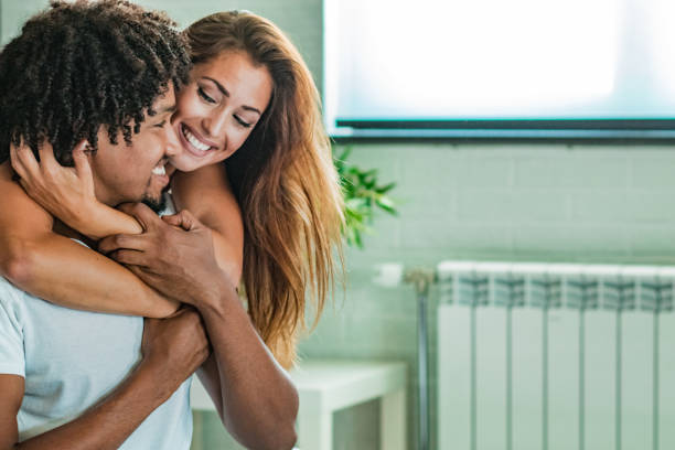 istock Young couple at home in bed smiling 1186156820