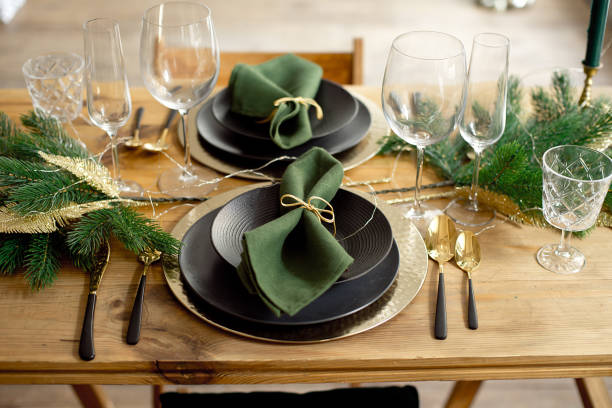 istock Christmas decoration with pine branches, table setting and candles on a dark Christmas tree background 1186157376