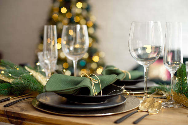 istock Table served for Christmas dinner in living room, close-up view, table setting, Christmas decoration 1186157747